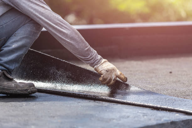 Professional Waterproofing technician working in Grand Ledge, MI